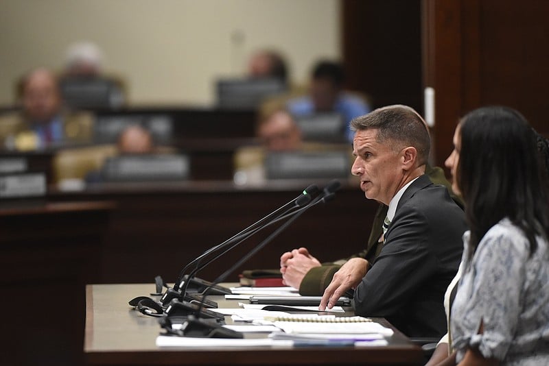Jeffrey Wood, chief of staff for the Arkansas Department of Military, answers questions from legislators Wednesday during the Uniform Personnel Classification and Compensation Plan subcommittee meeting at the state Capitol in Little Rock. .(Arkansas Democrat-Gazette/Staci Vandagriff)